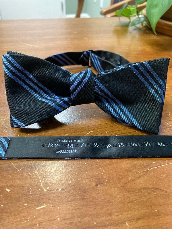 Product Description: Enjoy the luxury of the traditional Delta Phi Brotherhood bowtie, hand finished using the finest 100% silk and displaying the conservative "3 stripe" motif in traditional sky blue on a dark navy background that has been in use in the Fraternity for over 100 years. Perfect for business or casual wear, and a must have for any Delta Phi wardrobe. </br></br>Domestic Shipping included. </br></br>Contact Delta Phi National if you wish to ship internationally.</br> Delta Phi Brothers' Bow Tie